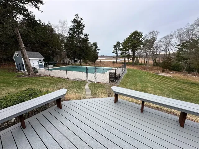 a view of a swimming pool with a patio