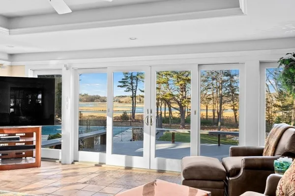 a view of a dining room with furniture window and outside view