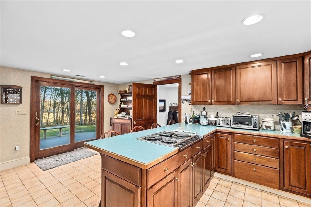 26 Mordecai Lincoln Road Scituate, MA 02066 - Photo 26 of 36 a kitchen with a sink stove and cabinets