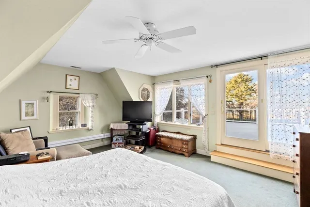 a bedroom with a workspace