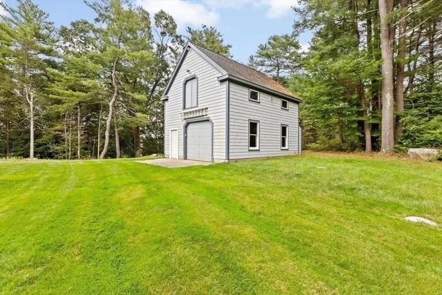 a view of house with backyard