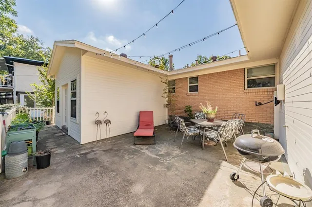 a swimming pool with outdoor seating and yard