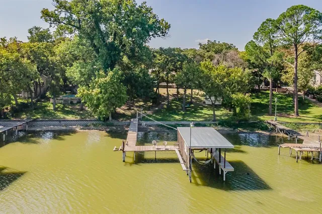 an aerial view of a house with a yard and garden