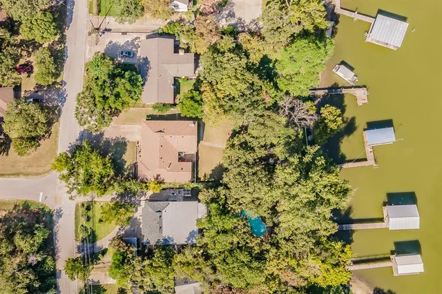 an aerial view of houses with yard