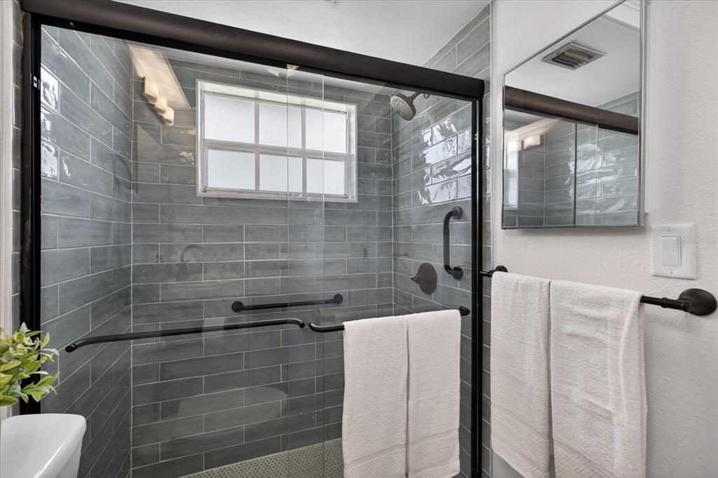 4116 Hampton Drive New Port Richey, FL 34652 - Photo 14 of 35 a bathroom with a bathtub and window