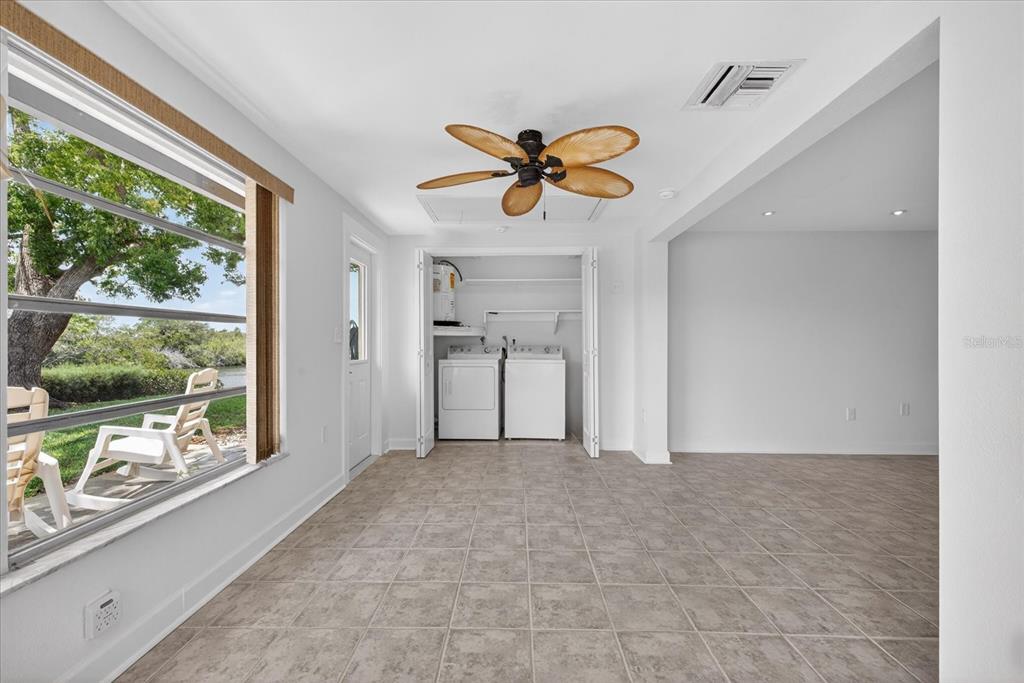 4116 Hampton Drive New Port Richey, FL 34652 - Photo 20 of 35 a view of a livingroom with a ceiling fan and window