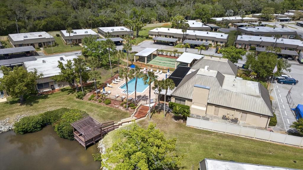4116 Hampton Drive New Port Richey, FL 34652 - Photo 29 of 35 an aerial view of multiple houses with yard