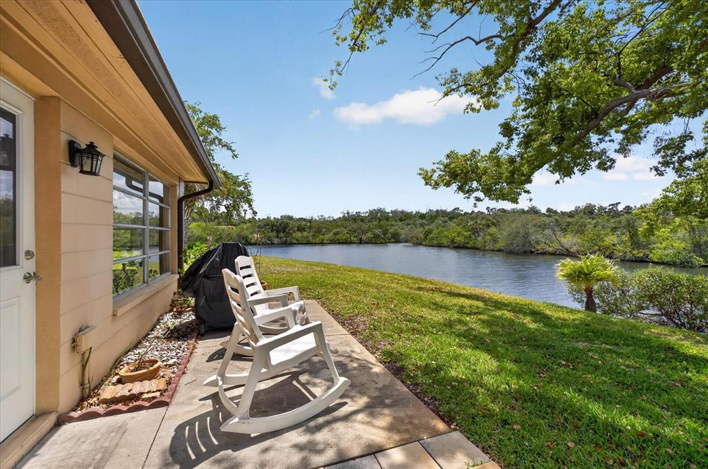 4116 Hampton Drive New Port Richey, FL 34652 - Photo 6 of 35 a view of a lake with couches chairs