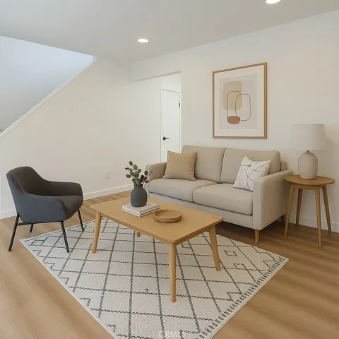 a living room with furniture and a rug