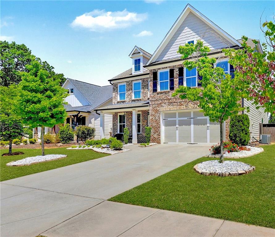 a front view of a house with a yard