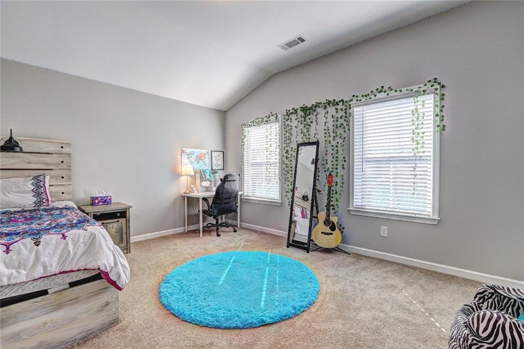 4371 Thacker Lane Suwanee, GA 30024 - Photo 30 of 52 a room with gym equipment and a window