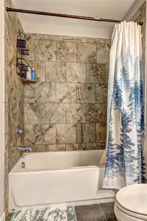 4371 Thacker Lane Suwanee, GA 30024 - Photo 34 of 52 a bathroom with a bathtub and shower
