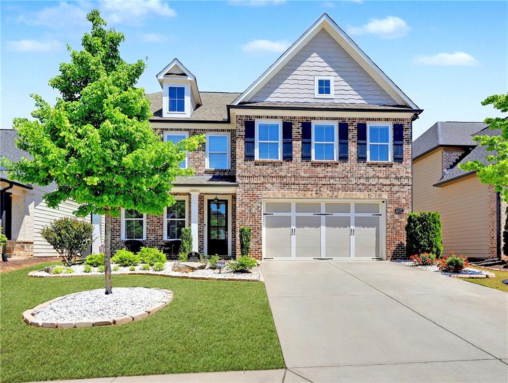 4371 Thacker Lane Suwanee, GA 30024 - Photo 43 of 52 a front view of a house with a yard