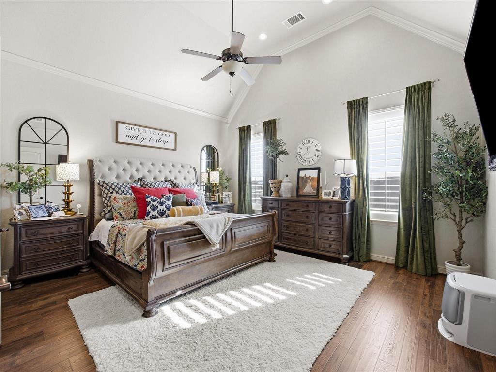 105 Mesquite Court Decatur, TX 76234 - Photo 14 of 36 Primary suite with ceiling fan and an en-suite