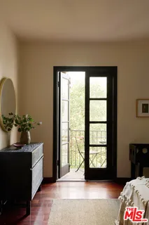 a view of a room with large windows