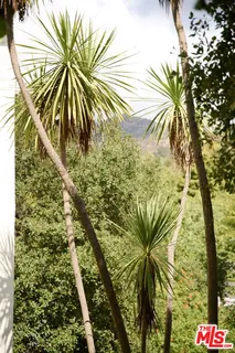 a view of a swimming pool with an outdoor seating