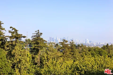 a view of balcony with wooden floor