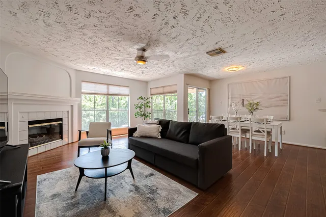 a living room with furniture dining table and a fireplace