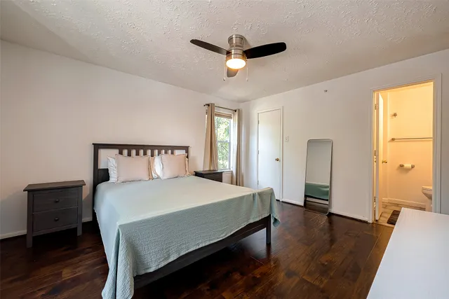 a bedroom with a bed and a table