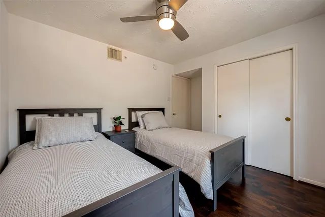 a bedroom with double bed and a night stand