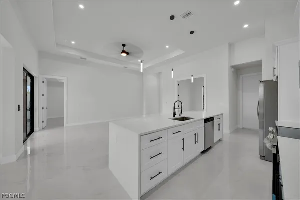 a large bathroom with a double vanity sink a mirror and a shower