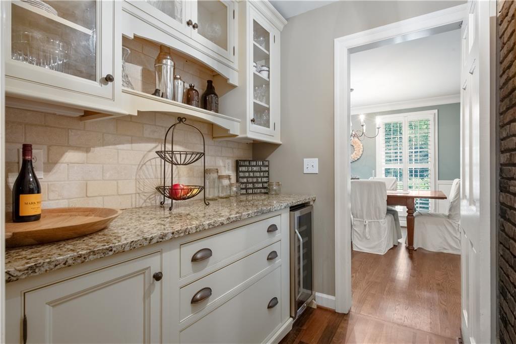 4220 Exeter Close Northwest Atlanta, GA 30327 - Photo 14 of 61 a hallway with sink and cabinets