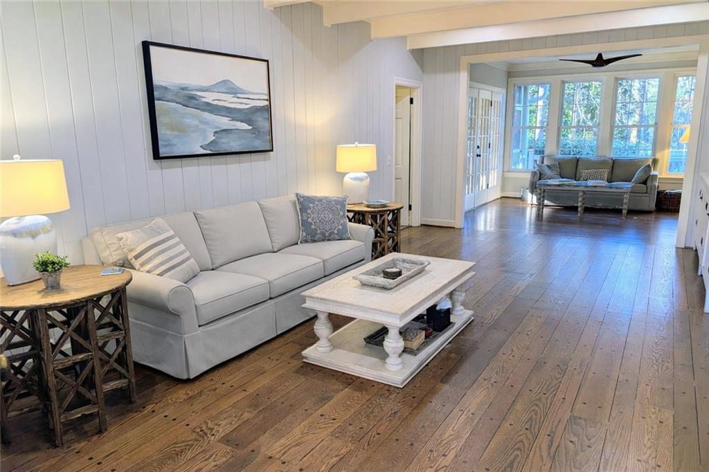 4220 Exeter Close Northwest Atlanta, GA 30327 - Photo 18 of 61 a living room with furniture and a wooden floor