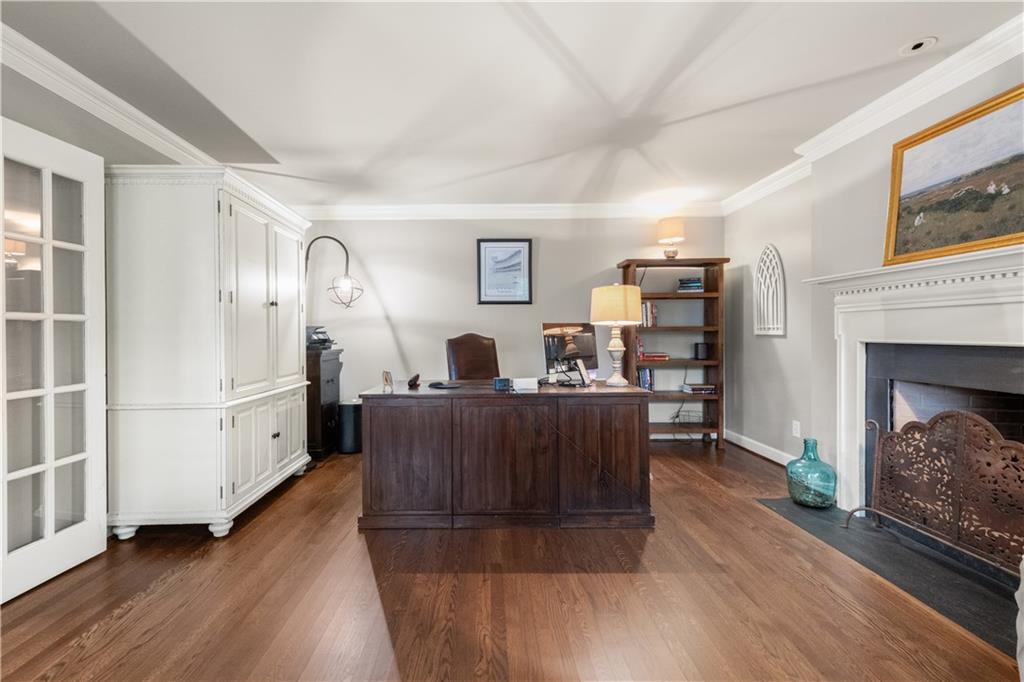 4220 Exeter Close Northwest Atlanta, GA 30327 - Photo 19 of 61 a living room with furniture and a fireplace