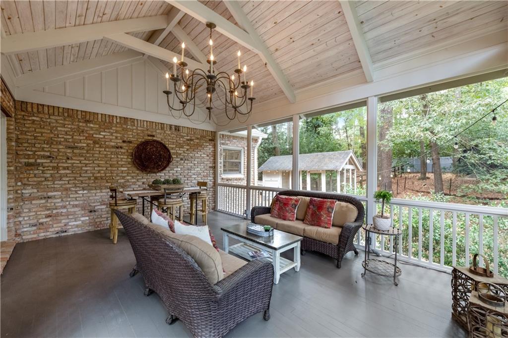4220 Exeter Close Northwest Atlanta, GA 30327 - Photo 22 of 61 a living room with furniture and a flat screen tv