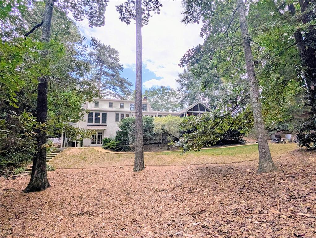 4220 Exeter Close Northwest Atlanta, GA 30327 - Photo 3 of 61 a view of a yard with plants