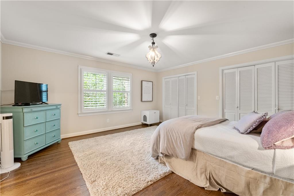 4220 Exeter Close Northwest Atlanta, GA 30327 - Photo 40 of 61 a bedroom with a bed and a window