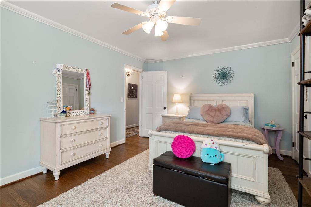 4220 Exeter Close Northwest Atlanta, GA 30327 - Photo 45 of 61 a bedroom with a bed and furniture