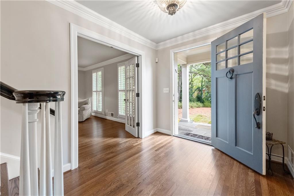 4220 Exeter Close Northwest Atlanta, GA 30327 - Photo 5 of 61 a view of livingroom with hardwood floor and a ceiling fan