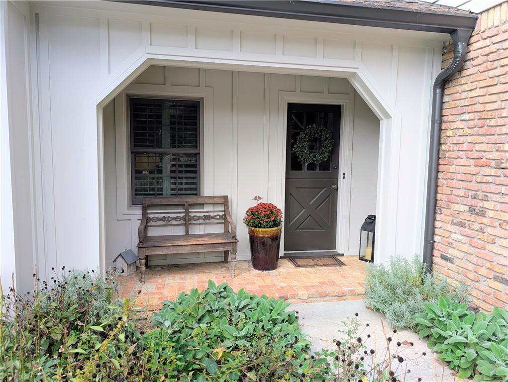 4220 Exeter Close Northwest Atlanta, GA 30327 - Photo 55 of 61 a front view of a house with outdoor seating