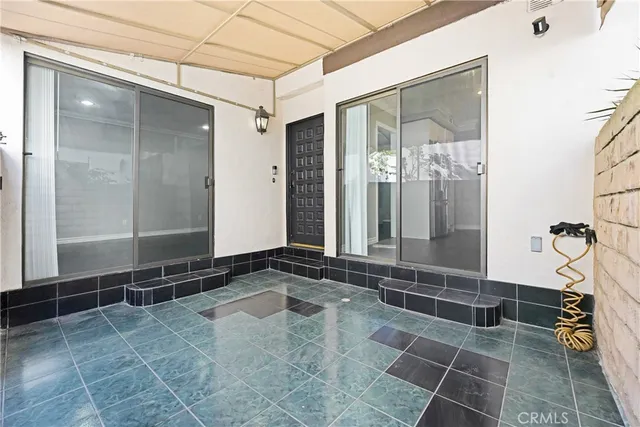 a bathroom with a glass door shower