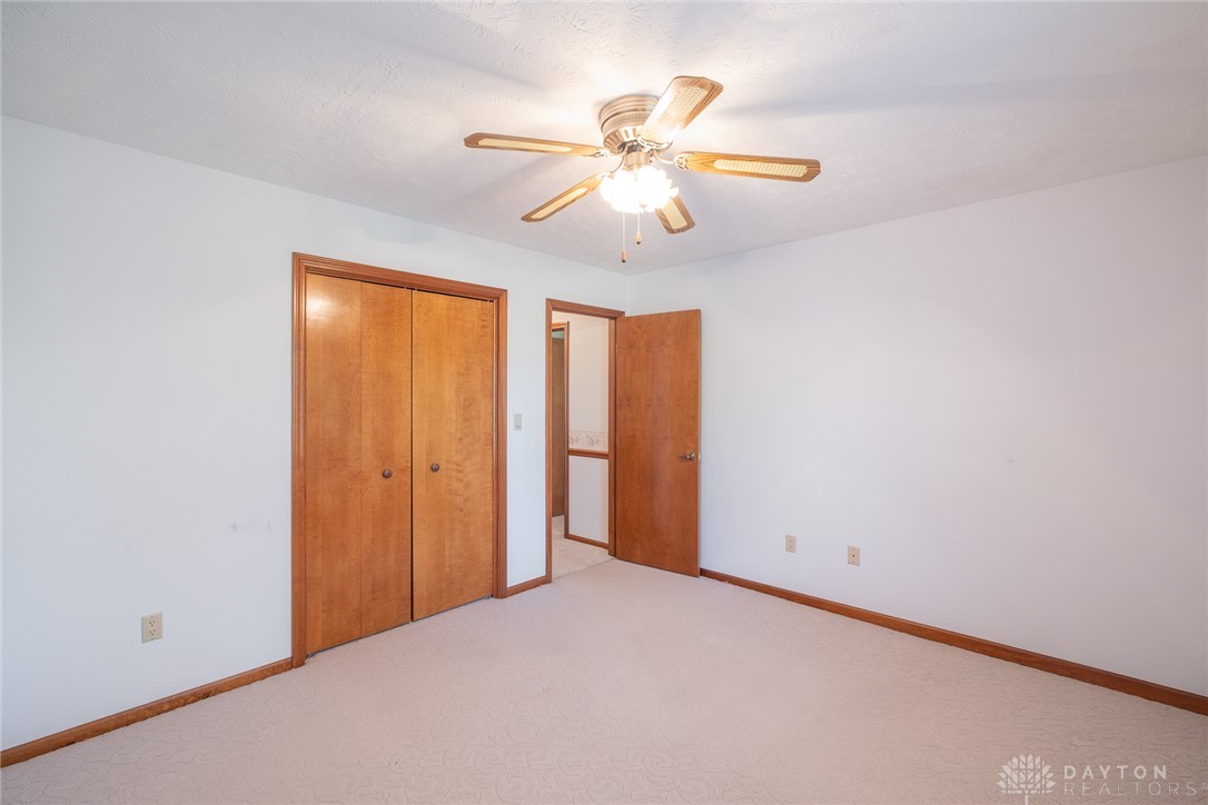 276 South Fairfield Road Bellbrook, OH 45305 - Photo 33 of 38 Bright and airy bedroom with a ceiling fan, offering a comfortable and serene retreat.
