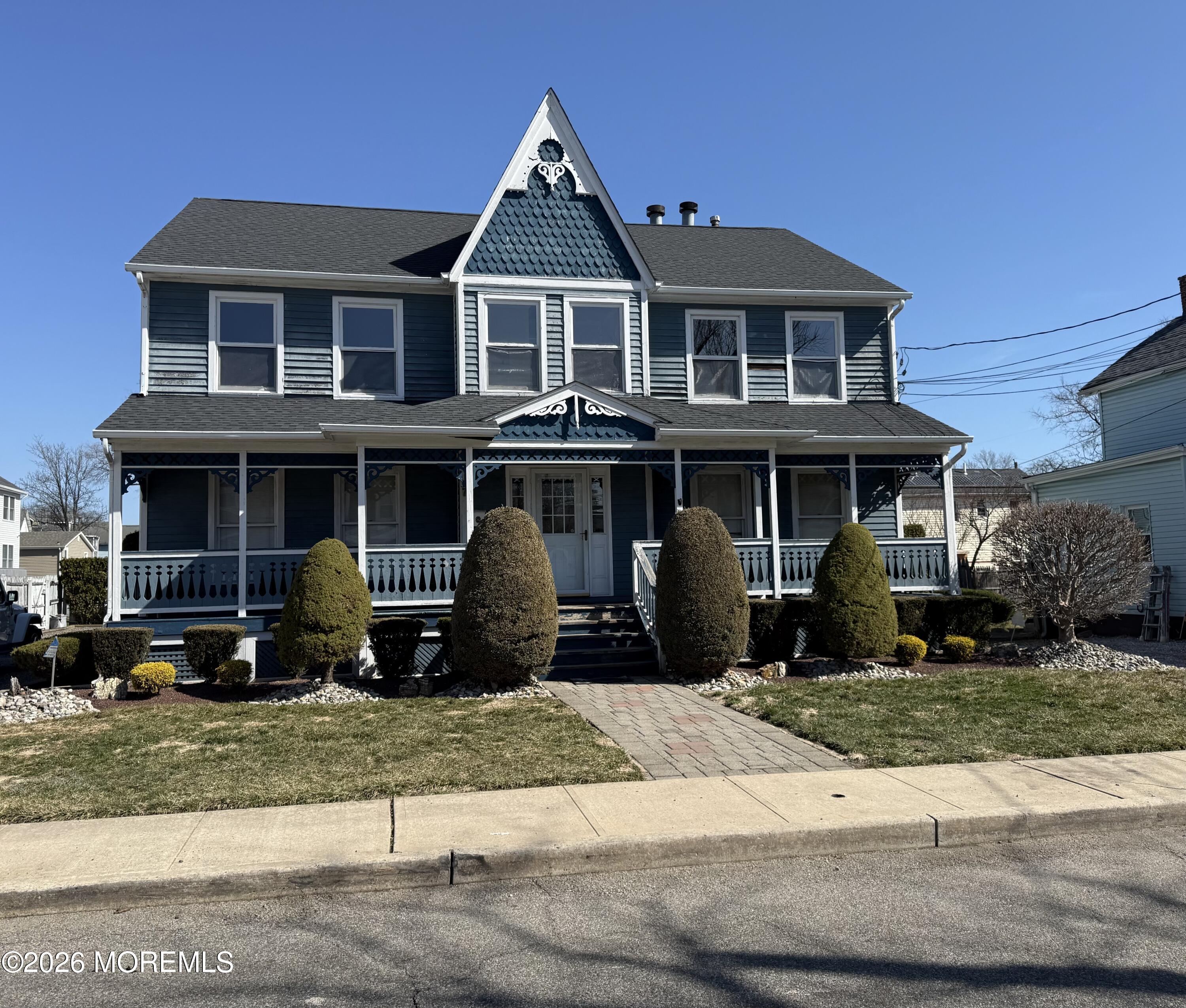 7 Clinton Street, Unit B Matawan, NJ 07747 - Photo 11 of 11 a front view of a house with a yard