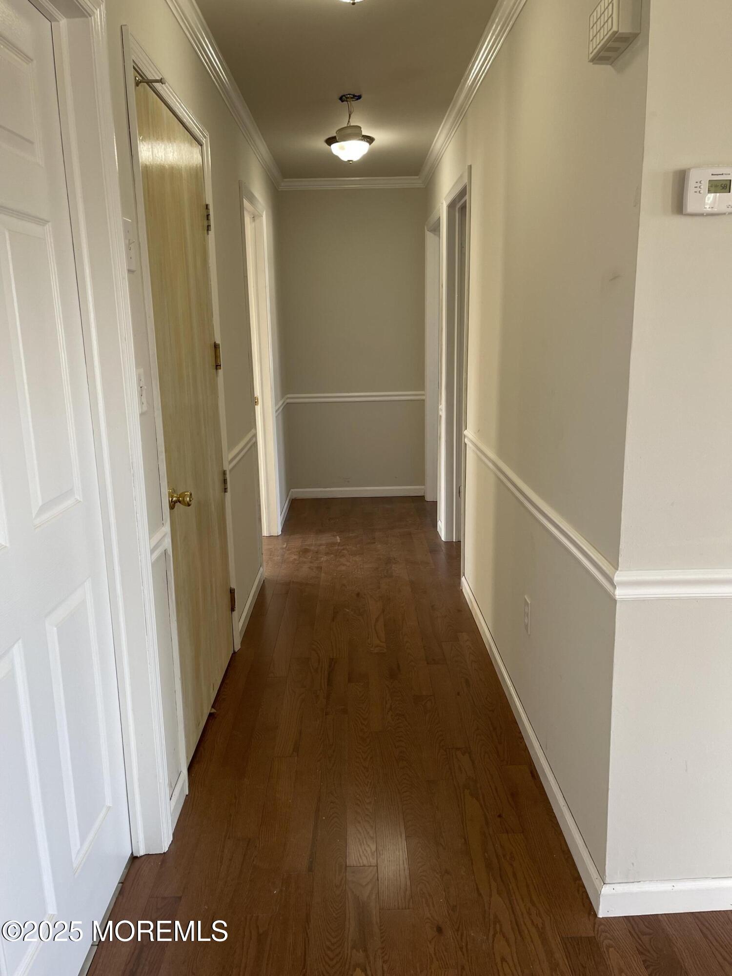 7 Clinton Street, Unit B Matawan, NJ 07747 - Photo 2 of 11 a view of hallway with wooden floor