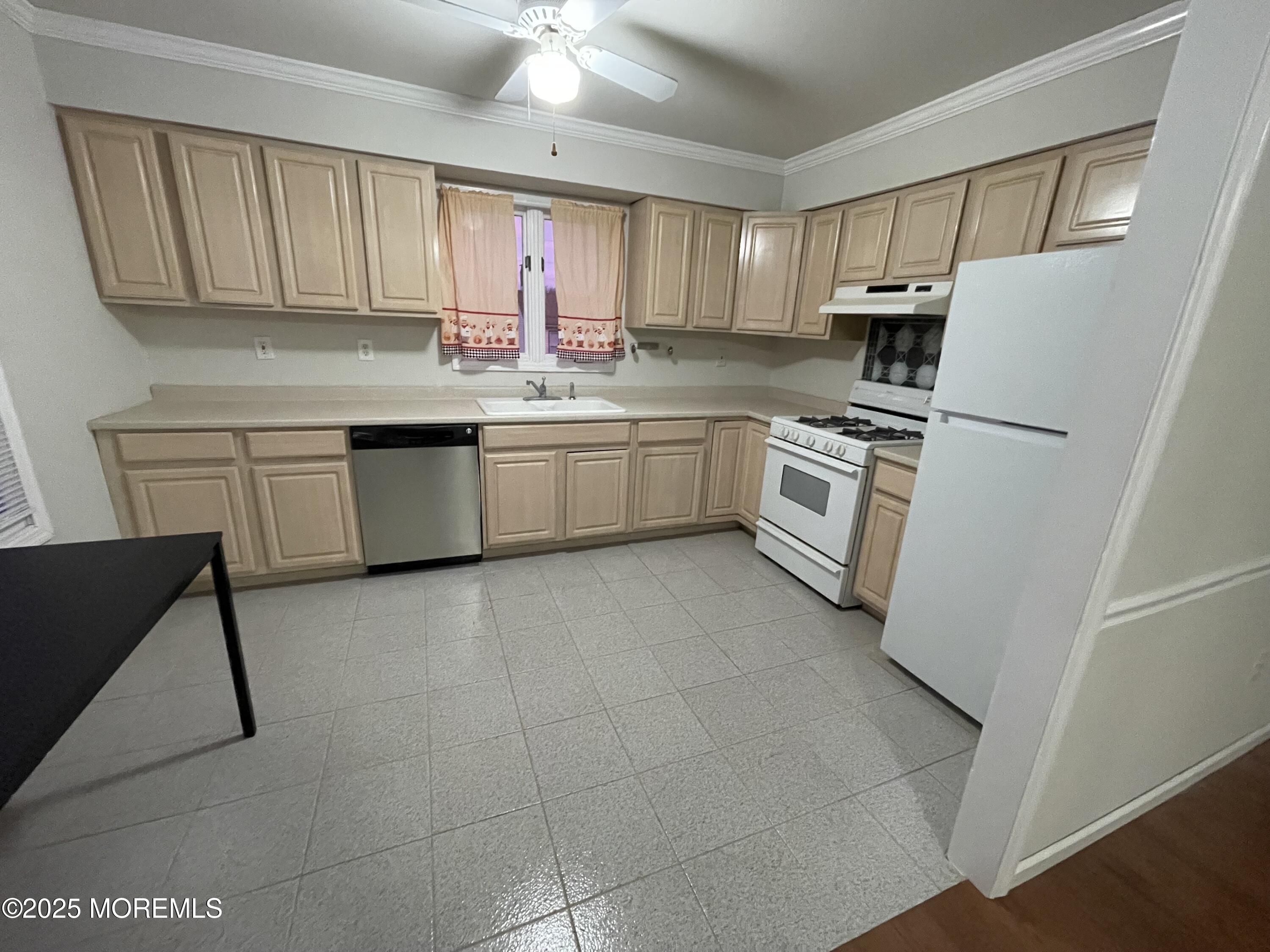 7 Clinton Street, Unit B Matawan, NJ 07747 - Photo 10 of 11 a kitchen with a white cabinets and white appliances