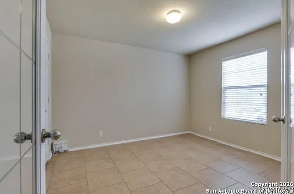 an empty room with a empty space and window