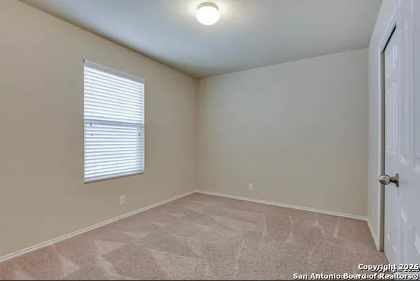 a view of a room that has a window in it