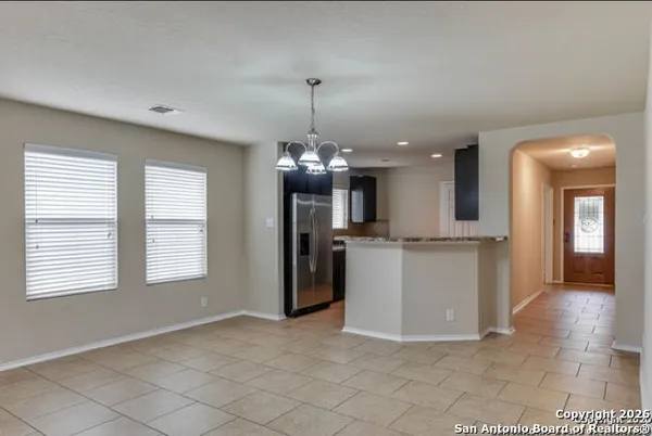 a view of a room with a kitchen