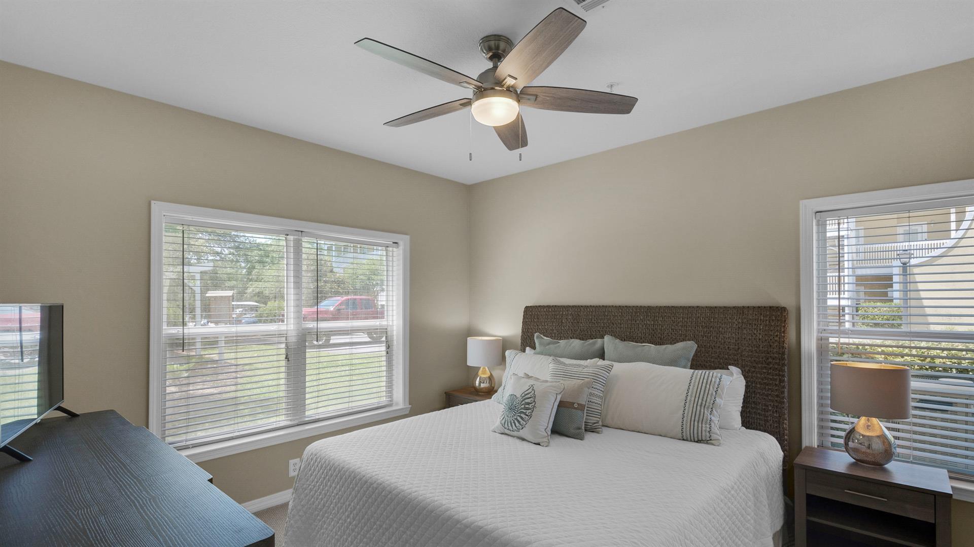 34 Heron's Watch Way, Unit 5101 Santa Rosa Beach, FL 32459 - Photo 17 of 33 a bedroom with a large bed and a large window