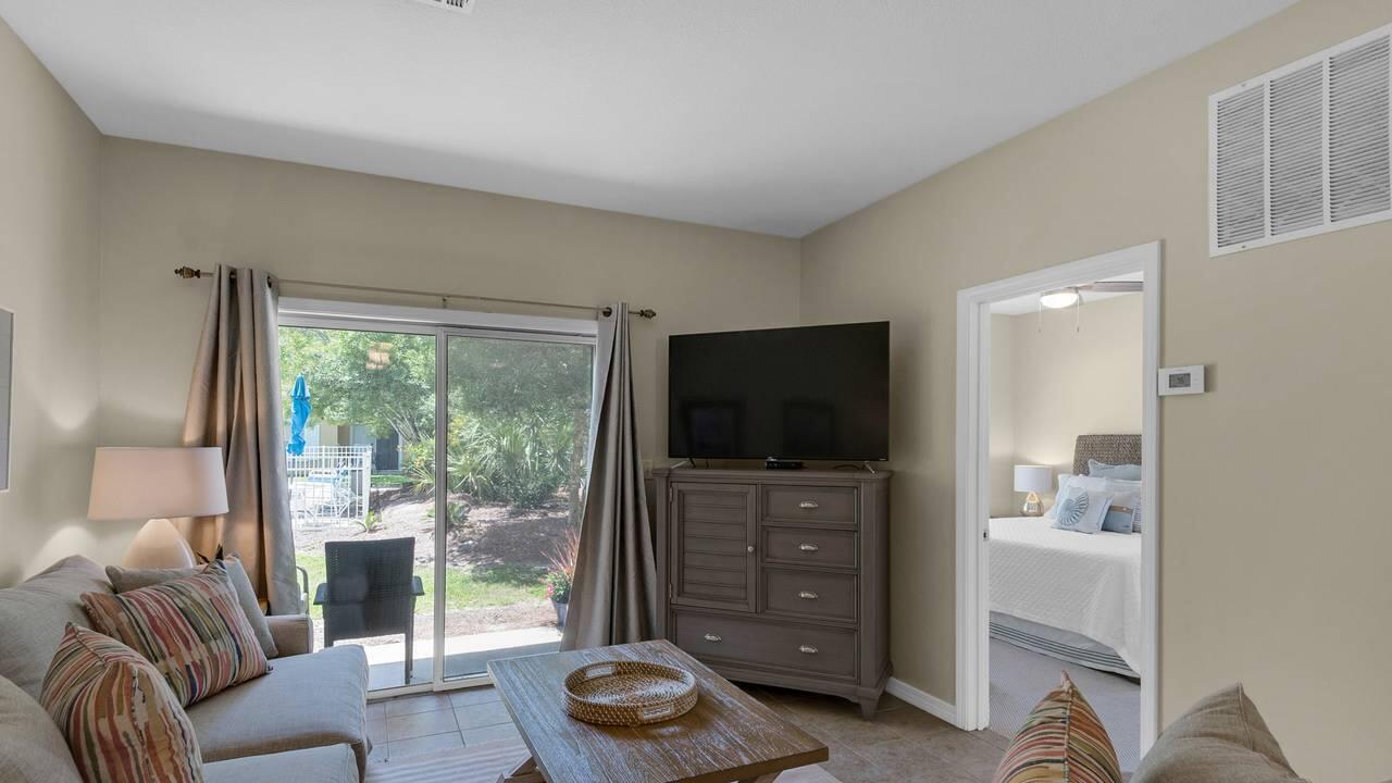 34 Heron's Watch Way, Unit 5101 Santa Rosa Beach, FL 32459 - Photo 2 of 33 a living room with furniture and a flat screen tv