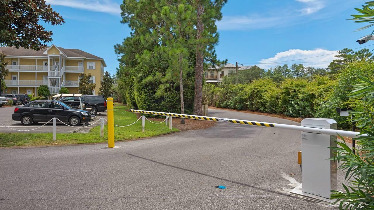 34 Heron's Watch Way, Unit 5101 Santa Rosa Beach, FL 32459 - Photo 25 of 33 a view of a chair and table in the back yard of the house