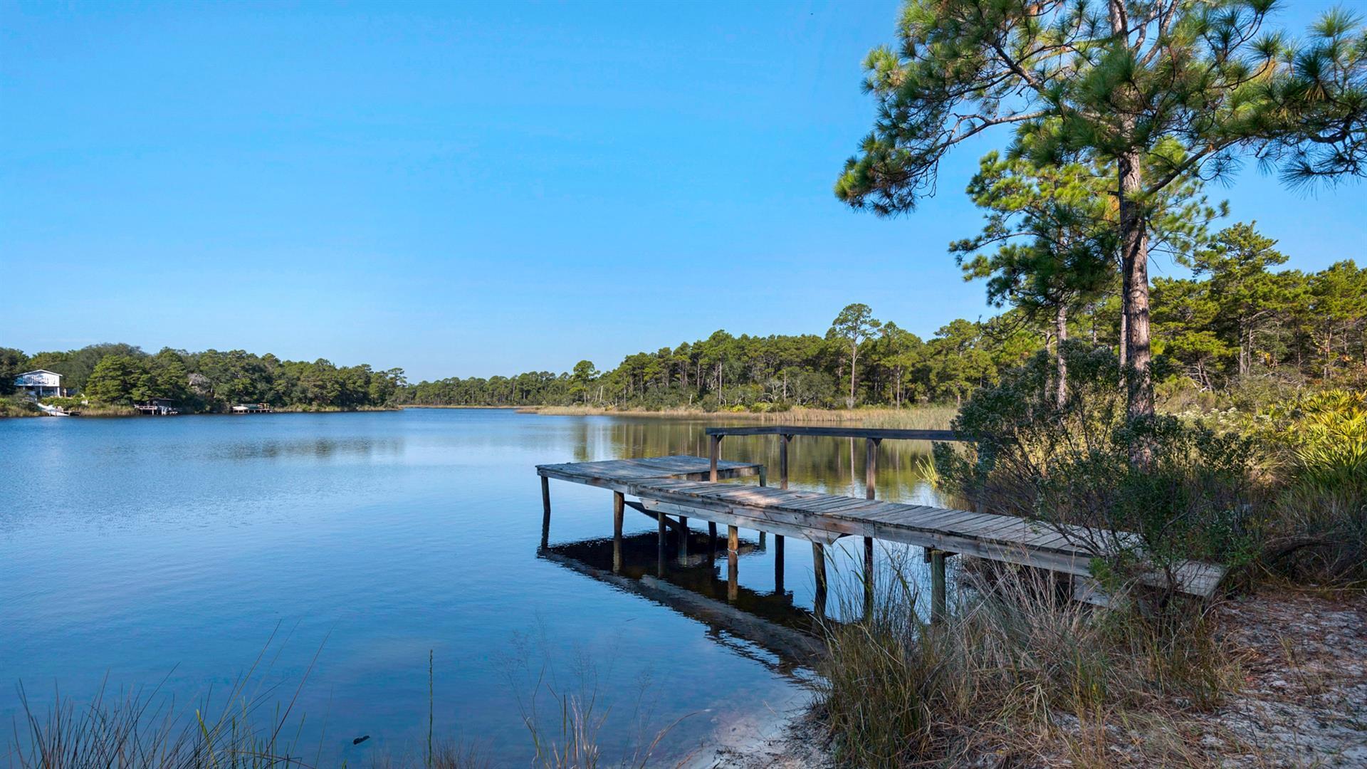 34 Heron's Watch Way, Unit 5101 Santa Rosa Beach, FL 32459 - Photo 30 of 33 a view of a lake with a mountain in the background