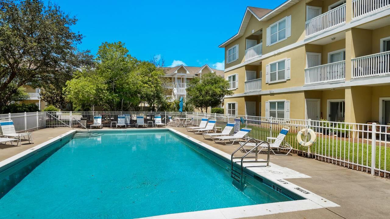 34 Heron's Watch Way, Unit 5101 Santa Rosa Beach, FL 32459 - Photo 10 of 33 a view of a swimming pool with a lounge chair