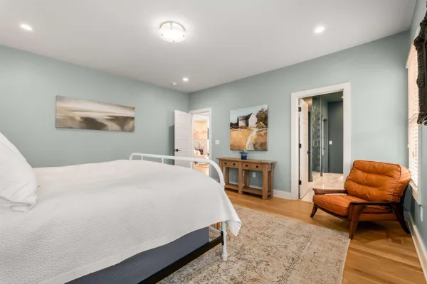 a view of walk in closet and bedroom