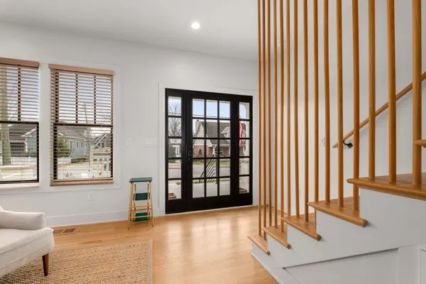 a dining room with furniture and wooden floor
