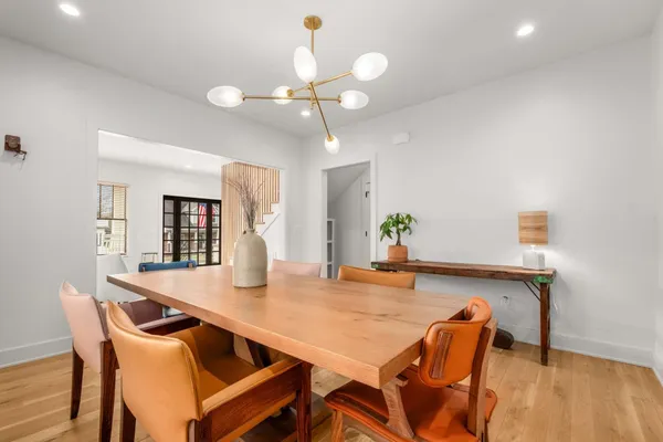 a large kitchen with stainless steel appliances granite countertop a large counter top and a stove top oven